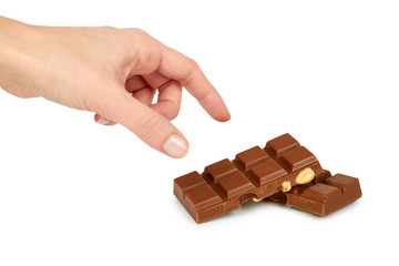Homemade chocolate bar with whole nuts in hand. Isolated on white background