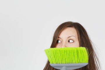 Close up of young fun crazy dizzy loony wild scared housewife with tousled hair isolated on white...