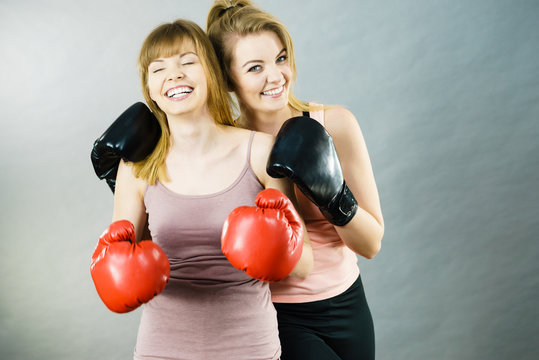 Two Women Friends Wearing Boxing Gloves