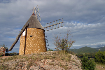 The restored windmill on the hill above St Chinian, Languedoc-Roussillon, France, Europe