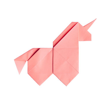 Handmade tender pink  trendy geometrical polygonal paper origami unicorn on white background isolated