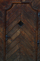 Wooden door in some Prague church, Czech. Exterior.