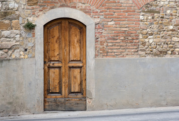 Wood door on red brick wall