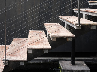 Modern staircase with the metal wire leader.