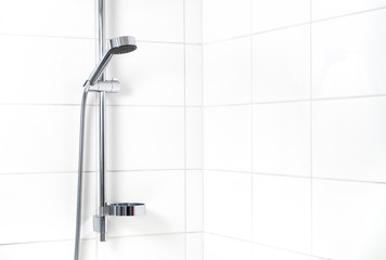 Modern shower with white wall tiles. Simple stylish Scandinavian home interior design. Clean fresh bathroom. - obrazy, fototapety, plakaty
