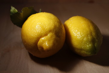 Yellow lemon, the fruit with dark background
