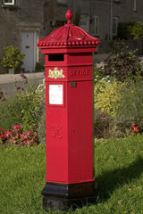 Fototapeta na wymiar England, Cotswolds, Gloucestershire, Tetbury, traditional old red royal mail post box