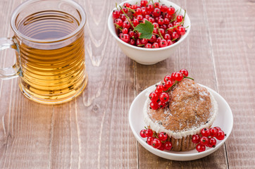 dessert with cake, red berries and a glass of tea/dessert with cake, red berries and a glass of tea. Top view