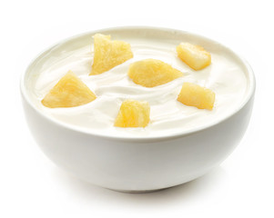 bowl of yogurt with pineapple pieces
