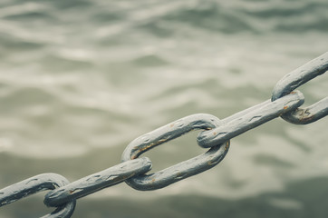 metal chain on water background/metal chain on water background. Copy space