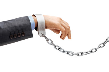 Man's hand in suit in chains isolated on white background. Close up, concept against violence