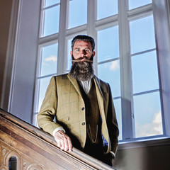 Smart man with a beard and moustache wearing a suit