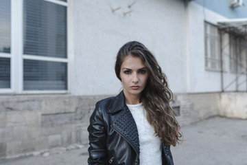 Fototapeta premium Urban portrait of a young woman