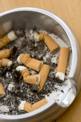 Ashtray full of extinguished cigarette butts