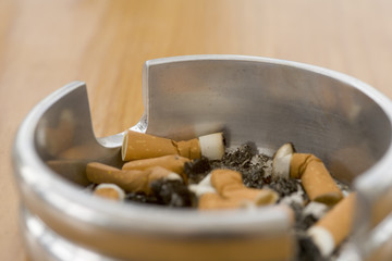 Ashtray full of extinguished cigarette butts