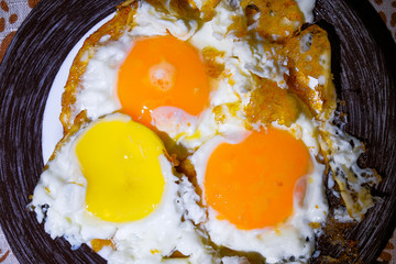 eggs are fried in a frying pan