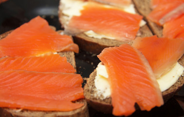 Fresh salmon sandwich with salted salmon and butter and dark bread