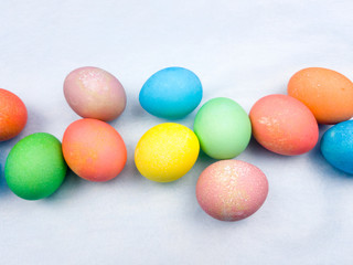 Fototapeta na wymiar Color easter eggs on pastel blue background. Close up.
