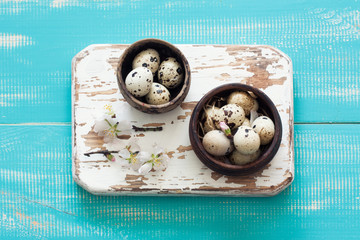 Quail eggs in a clay pots