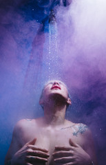 Obraz premium woman in shower with colorful steam