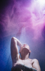 Obraz na płótnie Canvas woman in shower with colorful steam