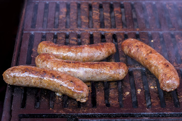 homemade sausages roasted in barbecue and in oil