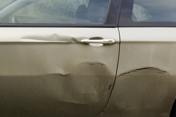 Dents in the side of car