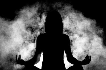 silhouette yoga girl with smoke