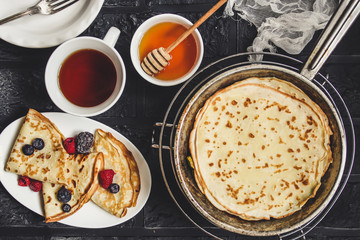 Pancakes with berries and sweet jam