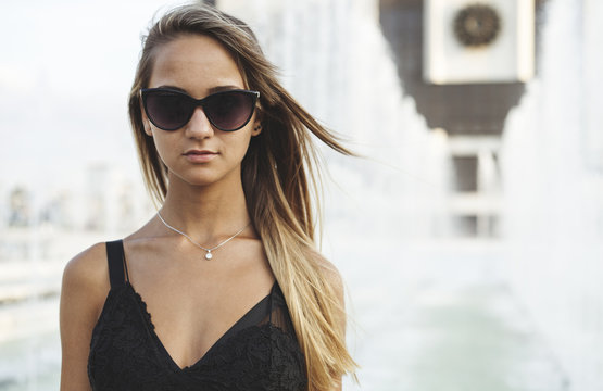 Summer portrait of an attractive female with sunglasses