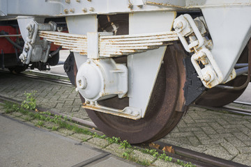Industrial background with detail of old freight railway carriage and suspension system in historical harbor of Rotterdam, Netherlands.