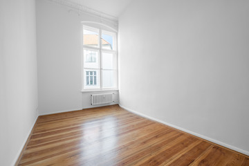 empty room with white walls and wooden floor,