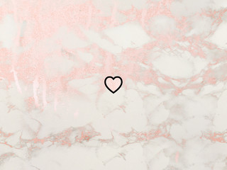 Happy Valentine's day. Heart symbol on pink marble background.