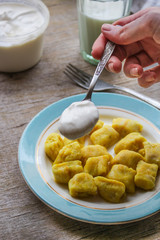 gnocchi in a plate on a wooden table
