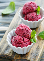 Balls of homemade ice cream of black currant.