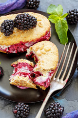 Homemade ice cream cookie sandwich with blackberry.
