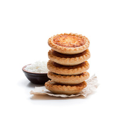 Stack  of coconut tarts isolated on white