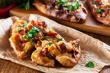 Traditional Turkish pide with meat and vegetables