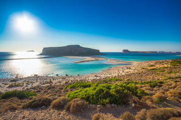 Amazing view of Balos Lagoon with magical turquoise waters, lagoons, tropical beaches of pure white sand and Gramvousa island on Crete, Greece