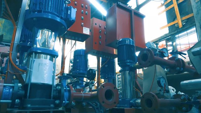 Low angle shot of a number of a new water pumps in a warehouse 