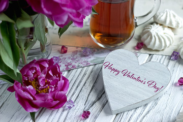 Valentines day greeting card with purple peonies tea glass marshmellow and lettering.