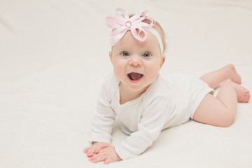 Close-up Portrait of Very Cute Adorable 8 Month Old  Baby Girl Daughter with Big Blue Eyes, Happy Baby Concept, Healthy Child