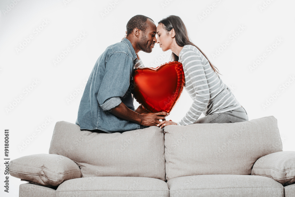 Poster side view profile of calm amorous couple sitting forehead to forehead with eyes closed. inflatable h