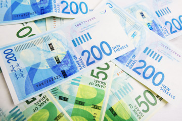 Israely Shekel money bills collection background.