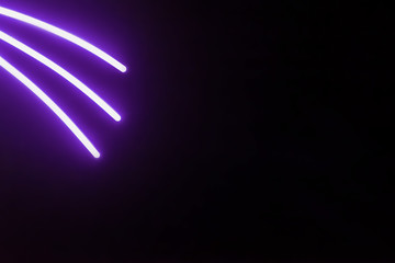 three pink glow sticks/ black background of the three pink glow sticks on top with ultraviolet color