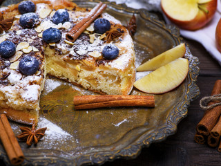 baked apple pie on an iron plate