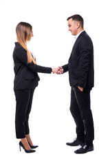 Smiling business partners shaking hands against a white background