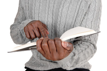 Closeup image of black man holding a book