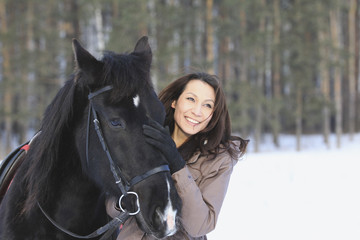 Obraz premium Young black hair woman with a horse
