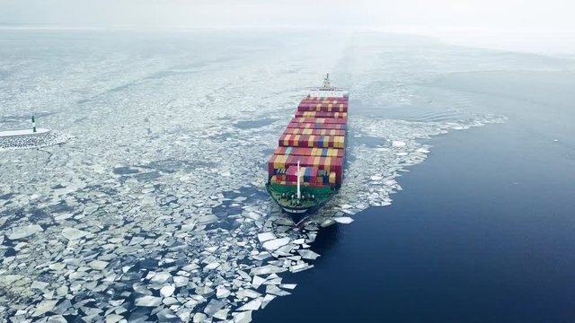 Aerial view of container ship in the sea at winter time